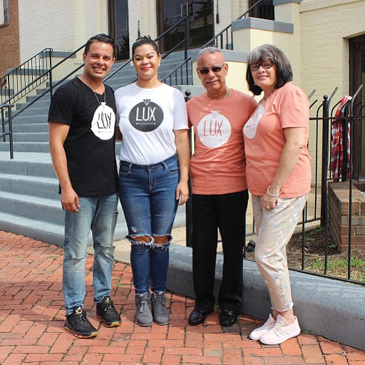 From left, Lux Church Pastor Victor I. “Manny” Peña and his wife, Christine, stand Sunday with Mr. Peña’s parents, Victor M. and Sonia Peña, outside the church’s new home on Leigh Street in Jackson Ward. 