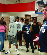 School Board member James “Scott” Barlow, right, welcomes more than 60 volunteers Tuesday at Carver Elementary School to help clean and spruce up the school through RPS Shines!