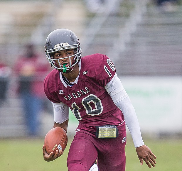 Virginia Union University quarterback Darius Taylor carries the ball during Saturday’s Media Day event at Hovey Field.