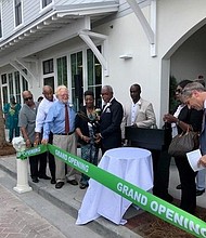 Beaufort County Black Chamber of Commerce President
Larry Holman cuts the Grand Opening Ribbon.
