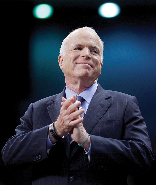 U.S. Sen. John McCain listens as he’s introduced at an October 2008 campaign rally in Fayetteville, N.C., during his run for president against then-Sen. Barack Obama.