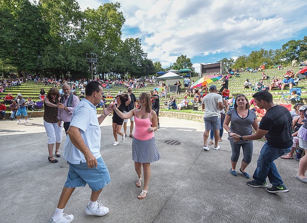Flavor of dance
The stage at Dogwood Dell amphitheater in Byrd Park turned into a dance floor last Saturday for couples to show off their best moves at the 11th Annual Latin Jazz and Salsa Festival. Hosted by the nonprofit Latin Jazz and Salsa Show/Festival Inc., the event featured a bevy of performers who made spectators want to get up and dance. 