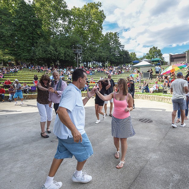 Flavor of dance
The stage at Dogwood Dell amphitheater in Byrd Park turned into a dance floor last Saturday for couples to show off their best moves at the 11th Annual Latin Jazz and Salsa Festival. Hosted by the nonprofit Latin Jazz and Salsa Show/Festival Inc., the event featured a bevy of performers who made spectators want to get up and dance. 
