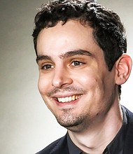 Damien Chazelle has responded to criticism over his choice to omit the iconic planting of the American flag on the moon in his upcoming Neil Armstrong biopic.