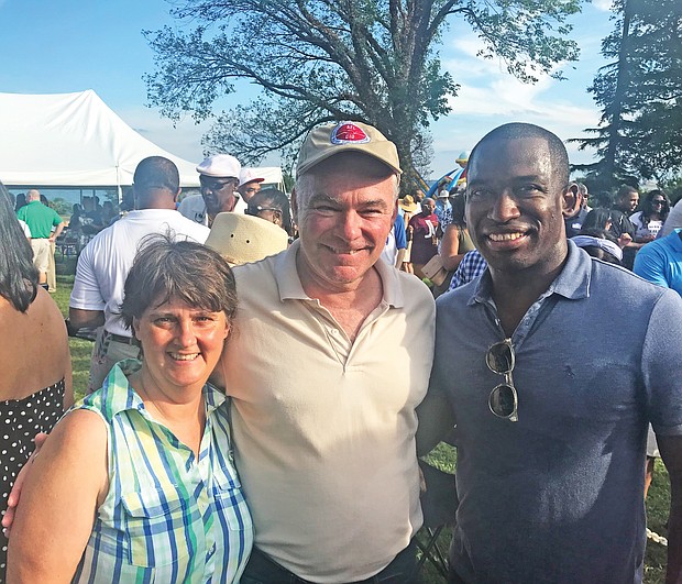 Politics and a party
U.S. Sen. Tim Kaine, center, hit the campaign trail Monday at Congressman Robert C. “Bobby” Scott’s 42nd Annual Labor Day Cookout. Pausing for a photo with Sen. Kaine are his wife, former Virginia Secretary of Education Anne Holton and Richmond Mayor Levar M. Stoney. (Brandon Gassaway)