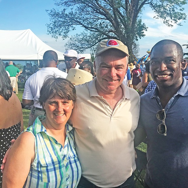 Politics and a party
U.S. Sen. Tim Kaine, center, hit the campaign trail Monday at Congressman Robert C. “Bobby” Scott’s 42nd Annual Labor Day Cookout. Pausing for a photo with Sen. Kaine are his wife, former Virginia Secretary of Education Anne Holton and Richmond Mayor Levar M. Stoney. (Brandon Gassaway)
