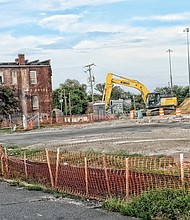 Heavy machinery digs up the ground in Jackson Ward to prepare for construction of a 154-unit apartment complex.(Sandra Sellars/Richmond Free Press)