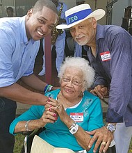 Politics and a party — 
Pausing for a photo with Lt. Gov. Justin E. Fairfax, left, are Ruby Walden of Suffolk and her son, Olin L. Walden, president of Olin Arctronics, a building design, real estate development and construction consulting firm in Hampton Roads. They were among hundreds of people enjoying food, music and political fare at Congressman Robert C. “Bobby” Scott’s 42nd Annual Labor Day Cookout Monday in Hampton. (Courtesy of Walden family)
