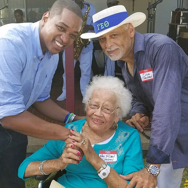 Politics and a party — 
Pausing for a photo with Lt. Gov. Justin E. Fairfax, left, are Ruby Walden of Suffolk and her son, Olin L. Walden, president of Olin Arctronics, a building design, real estate development and construction consulting firm in Hampton Roads. They were among hundreds of people enjoying food, music and political fare at Congressman Robert C. “Bobby” Scott’s 42nd Annual Labor Day Cookout Monday in Hampton. (Courtesy of Walden family)
