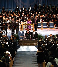Together in the pulpit at Greater Grace Temple during the service are, from left, Minister Louis Farrakhan of the Nation of Islam; the Rev. Al Sharpton of the National Action Network; the Rev. Jesse L. Jackson Sr. of the National PUSH Rainbow Coalition; and former President Bill Clinton. Mourners at the packed Greater Grace Temple in Detroit rise near the end of the eight-hour service for Ms. Franklin.
