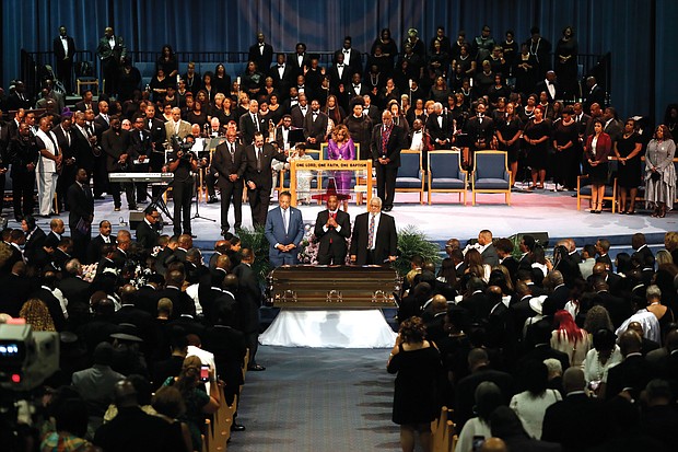 Together in the pulpit at Greater Grace Temple during the service are, from left, Minister Louis Farrakhan of the Nation of Islam; the Rev. Al Sharpton of the National Action Network; the Rev. Jesse L. Jackson Sr. of the National PUSH Rainbow Coalition; and former President Bill Clinton. Mourners at the packed Greater Grace Temple in Detroit rise near the end of the eight-hour service for Ms. Franklin.