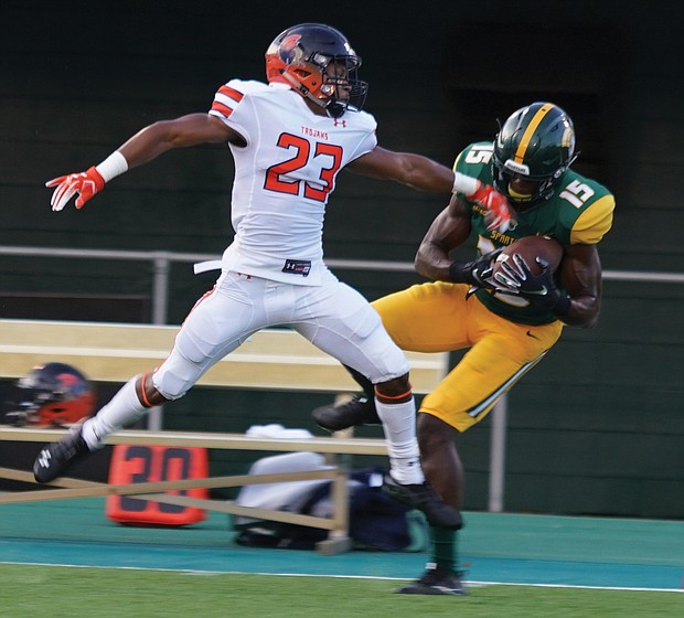 Virginia State University defensive back Diontae Bruce goes airborne trying to snatch the catch from Norfolk State University wide receiver Chuma Awanna during the Labor Day Classic last Saturday in Norfolk.