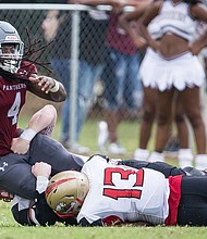 Virginia Union University wide receiver Olu Izegwire, left, is taken down by Seton Hill University’s Daquan Glover during last Saturday’s opening game at Hovey Field.  