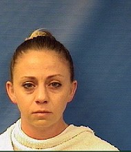 Amber Guyger, who is white, was off-duty when she shot Botham Shem Jean, a black man, police said Thursday.