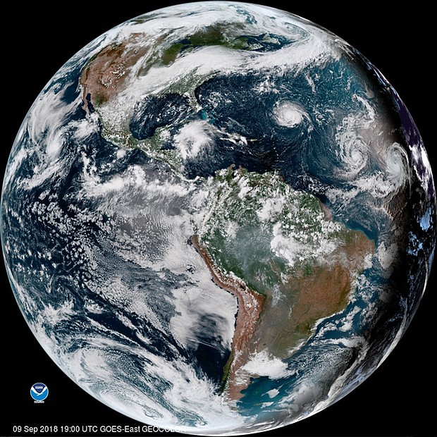 An enhanced satellite image showing Hurricane Florence, third from right, west of Isaac and Helene.
