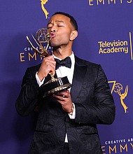 The singer/actor won an Emmy at the Creative Arts Emmy Awards in Los Angeles on Sunday along with Andrew Lloyd Webber and Tim Rice for producing the best variety special winner, "Jesus Christ Superstar Live in Concert."