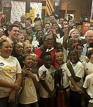 Oprah Winfrey will help volunteers pack meals for school children on Tuesday.