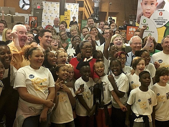 Oprah Winfrey will help volunteers pack meals for school children on Tuesday.