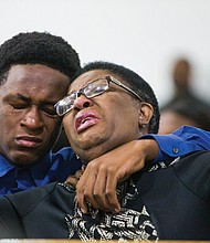 Allison Jean leans on her son, Brandt, during a prayer service last Sunday at Dallas West Church of Christ for her 26-year-old son, Botham Jean, above, who was shot and killed in his apartment Sept. 6 by Dallas Police Officer Amber Guyger.