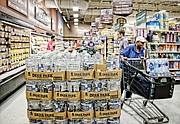 Shoppers at Farm Fresh supermarket on East Main Street in Richmond’s Shockoe Bottom fill up on bottled water and supplies Tuesday as Hurricane Florence threatens Virginia and at least three other states.