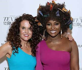 NaturallyCurly co-founder, Michelle Breyer (L) and recording artist Amara La Negra (R) seen at NaturallyCurly presents Texture On The Runway powered by Sally Beauty in New York City. (PRNewsfoto/NaturallyCurly