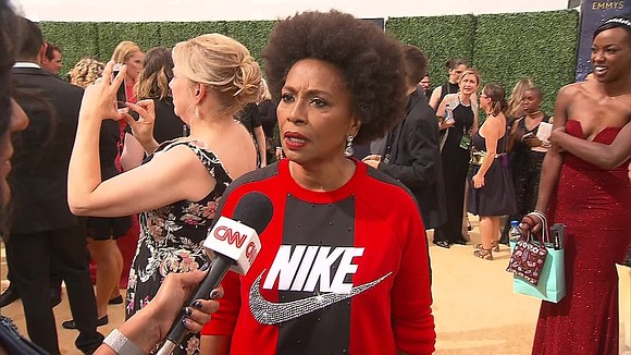 "Black-ish" actress Jenifer Lewis wore a red and black Nike shirt on the Emmys red carpet Monday night as a …
