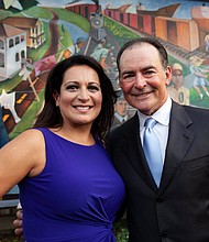 Christina Morales and Orlando Sanchez in front of the Mexican-American History & Culture in 20th Century Houston mural