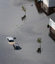 Cars and first floors of homes are submerged Monday in Fayetteville, N.C., in the aftermath of Hurricane Florence. 