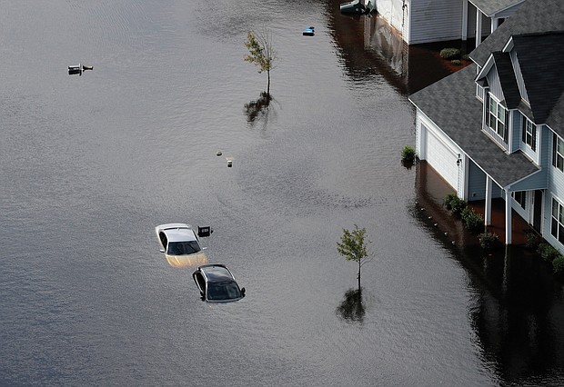 Cars and first floors of homes are submerged Monday in Fayetteville, N.C., in the aftermath of Hurricane Florence. 