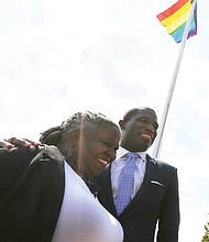 Mayor Levar M. Stoney joins Lacette Cross, co-founder of Black Pride RVA, in celebrating Virginia Pride Week as the rainbow flag flies above them on Brown’s Island. Wednesday’s ceremony raising the banner of the LGBTQ community took place ahead of the popular VA PrideFest scheduled for 11 a.m. to 9 p.m. Saturday, Sept. 22, on the Downtown riverfront island.