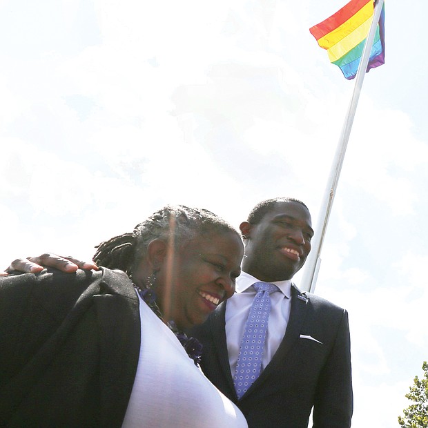 Mayor Levar M. Stoney joins Lacette Cross, co-founder of Black Pride RVA, in celebrating Virginia Pride Week as the rainbow flag flies above them on Brown’s Island. Wednesday’s ceremony raising the banner of the LGBTQ community took place ahead of the popular VA PrideFest scheduled for 11 a.m. to 9 p.m. Saturday, Sept. 22, on the Downtown riverfront island.