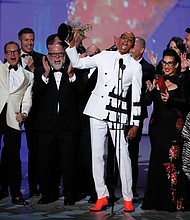 RuPaul Charles, originator of “RuPaul’s Drag Race,” is cheered by a bevy of supporters while accepting the Emmy for outstanding reality-competition program.