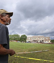 Earnest Claxton of Richmond surveys the damage in his former Chesterfield County neighborhood on Tuesday after learning about the destruction in the area caused Monday by tornadoes spawned by remnants of Hurricane Florence.