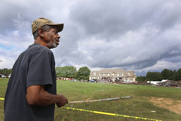 Earnest Claxton of Richmond surveys the damage in his former Chesterfield County neighborhood on Tuesday after learning about the destruction in the area caused Monday by tornadoes spawned by remnants of Hurricane Florence.