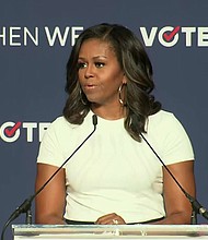 Former first lady Michelle Obama on Sunday urged Democrats to turn out for the midterm elections, telling them "democracy continues with or without you."