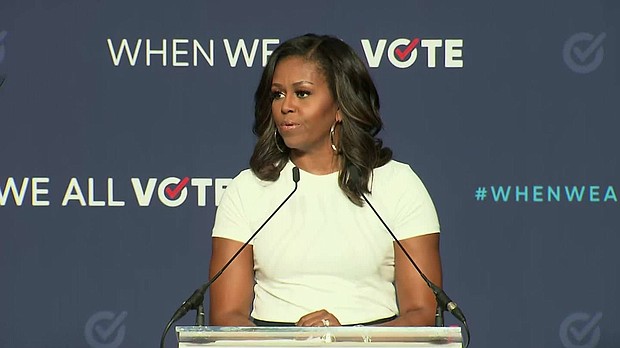 Former first lady Michelle Obama on Sunday urged Democrats to turn out for the midterm elections, telling them "democracy continues with or without you."