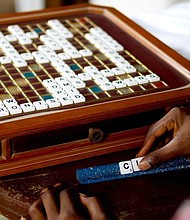 The sixth edition of Merriam-Webster's "Official Scrabble Players Dictionary" includes 300 words such as twerk, beatdown and sriracha.
