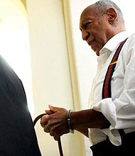 Bill Cosby in handcuffs going to jail for sexual assault