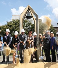 Mayor Levar M. Stoney, center, is flanked by City Council members Kim Gray, center left, and Ellen Robertson as he leads the official groundbreaking Tuesday for a $34 million apartment complex going up on the former site of St. Joseph’s Catholic Church at 1st and Jackson Streets in Jackson Ward. The bell in the background is the last remnant of the long demolished church that at one time was the first Catholic church in the country built for a black congregation. When completed, the complex is to include 154 units, with 72 to be set aside for current residents of Fay Towers, which is being vacated. Also taking part are representatives of the development partners the Richmond Redevelopment and Housing Authority and the Community Preservation and Development Corp., as well as those of other participating public agencies and private companies.