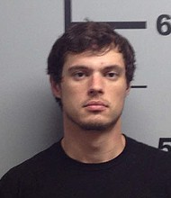 The son of U.S. Rep. Steve Womack, R.-Ark., was arrested Thursday (Sept. 27) on 11 charges, including several related to drugs and firearms.