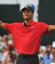 Tiger Woods reacts to his victory at the Tour Championship golf tournament Sunday at East Lake Golf Club in Atlanta.