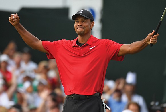 Tiger Woods was moved to the brink of tears after capturing his first title since 2013 with a two-stroke triumph ...