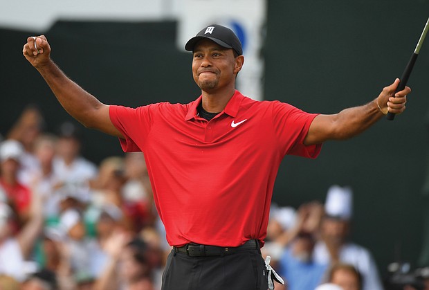 Tiger Woods reacts to his victory at the Tour Championship golf tournament Sunday at East Lake Golf Club in Atlanta.