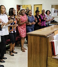 Larry Bland rehearses with choir members last Saturday at Second Baptist Church to get ready for the 11 a.m. worship service Sunday, Sept. 30, at St. Peter Baptist Church in Henrico County. 