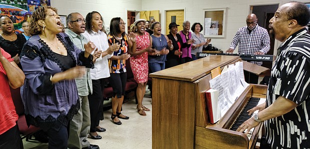 Larry Bland rehearses with choir members last Saturday at Second Baptist Church to get ready for the 11 a.m. worship service Sunday, Sept. 30, at St. Peter Baptist Church in Henrico County. 