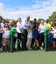 Ribbon-cutting photo--Adults from left:
Tom Gall, Houston Parks Board
Michael Isermann, Houston Parks and Recreation Department
Council Member Dwight Boykins, Houston City Council
Rebecca Williams, NJTL Alumni & Project Advocate
Bronwyn Greer, Fayez Sarofim & Co. U.S. Men's Clay Court Championship
Jamal Morgan, NJTL Instructor
Emily Schaefer, NJTL Program Director
Kenneth Allen, Houston Parks and Recreation Department