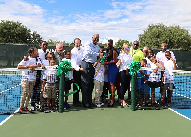 Ribbon-cutting photo--Adults from left:
Tom Gall, Houston Parks Board
Michael Isermann, Houston Parks and Recreation Department
Council Member Dwight Boykins, Houston City Council
Rebecca Williams, NJTL Alumni & Project Advocate
Bronwyn Greer, Fayez Sarofim & Co. U.S. Men's Clay Court Championship
Jamal Morgan, NJTL Instructor
Emily Schaefer, NJTL Program Director
Kenneth Allen, Houston Parks and Recreation Department