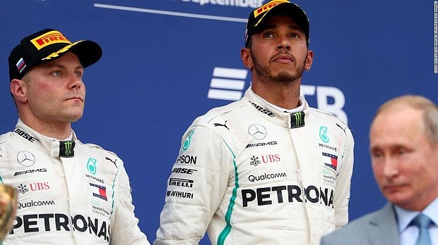 Lewis Hamilton led a Mercedes one-two in the Russian Grand Prix to extend his title lead to 50 points after teammate and pole sitter Valtteri Bottas was ordered to let him pass just over halfway through Sunday's race in Sochi.
