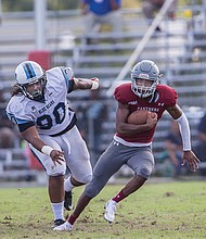 Panthers quarterback Darius Taylor streaks past Livingstone College’s William Moore Jr. during last Saturday’s game at Hovey Field. Virginia Union University won the game 52-19.