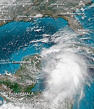 Michael will dump heavy rain on Cuba before heading toward the US.
